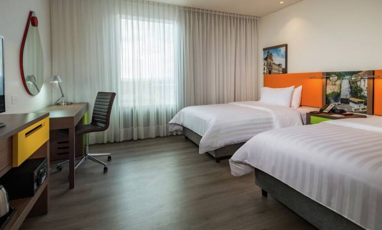 Twin room with working station at the Hampton by Hilton Bogota Airport.