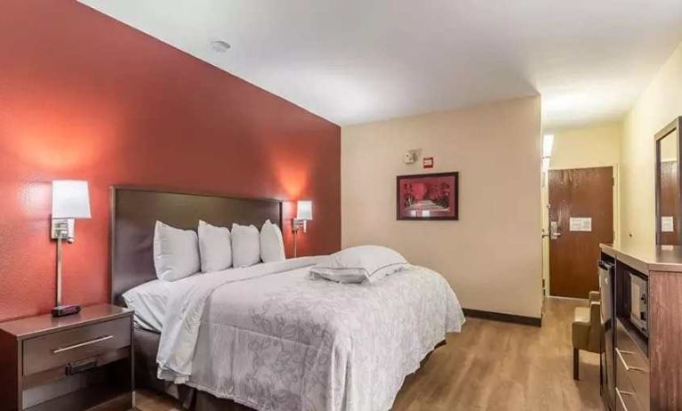 Spacious delux king bedroom at Red Roof PLUS+ & Suites Houston - IAH Airport SW.