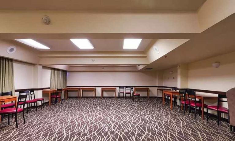 Quiet meeting room ideal for working remotely or for business meetings at Red Roof PLUS+ & Suites Houston - IAH Airport SW.