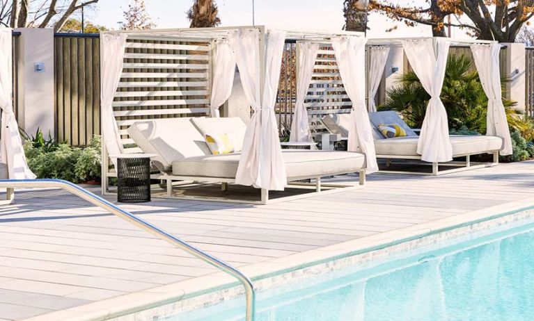 Relaxing outdoor pool at the AC Hotel By Marriott Pleasanton.