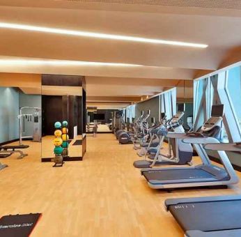 Fitness center at the AlRayyan Hotel Doha, Curio Collection by Hilton.