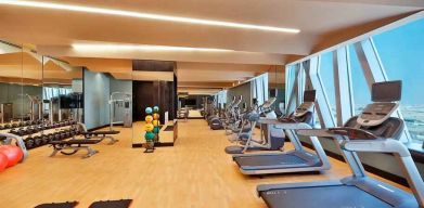 Fitness center at the AlRayyan Hotel Doha, Curio Collection by Hilton.