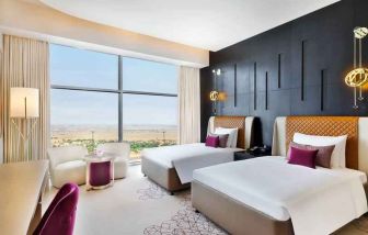 Twin room at the AlRayyan Hotel Doha, Curio Collection by Hilton.