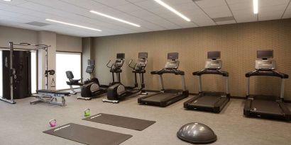 Fitness center with treadmills at Courtyard By Marriott Los Angeles LAX/Century Boulevard.