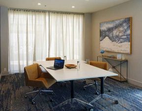 Meeting room with small table at Courtyard By Marriott Los Angeles LAX/Century Boulevard.