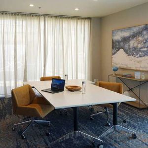 Meeting room with small table at Courtyard By Marriott Los Angeles LAX/Century Boulevard.