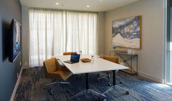 Meeting room with small table at Courtyard By Marriott Los Angeles LAX/Century Boulevard.