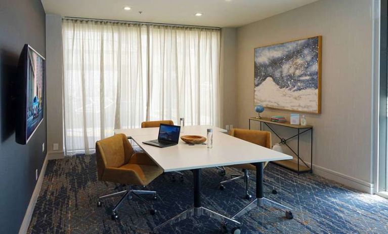 Meeting room with small table at Courtyard By Marriott Los Angeles LAX/Century Boulevard.