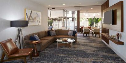 Lobby workspace at Courtyard By Marriott Los Angeles LAX/Century Boulevard.