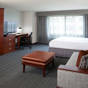 Hotel room with workstation at Courtyard By Marriott Los Angeles LAX/Century Boulevard.