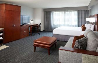 Hotel room with workstation at Courtyard By Marriott Los Angeles LAX/Century Boulevard.