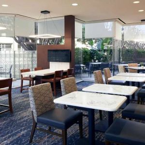 Dining area perfect for co-working at Courtyard By Marriott Los Angeles LAX/Century Boulevard.