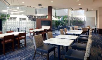 Dining area perfect for co-working at Courtyard By Marriott Los Angeles LAX/Century Boulevard.