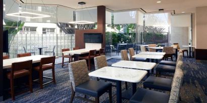 Dining area perfect for co-working at Courtyard By Marriott Los Angeles LAX/Century Boulevard.