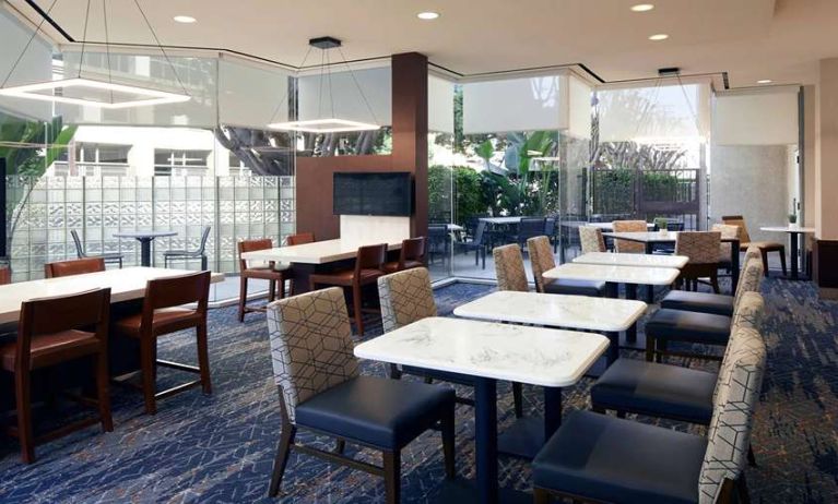 Dining area perfect for co-working at Courtyard By Marriott Los Angeles LAX/Century Boulevard.