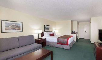 Queen room with sofa at Riviera Plaza And Conference Centre Calgary Airport.