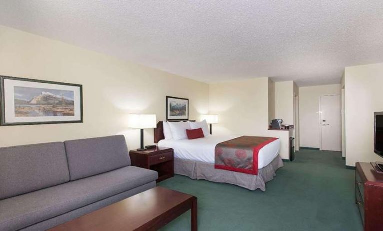 Queen room with sofa at Riviera Plaza And Conference Centre Calgary Airport.