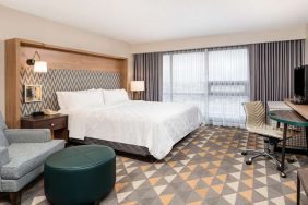 King bedroom with workstation at Holiday Inn Toronto Airport East.