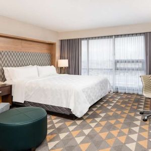 King bedroom with workstation at Holiday Inn Toronto Airport East.