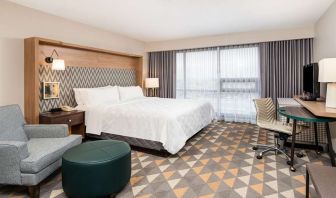 King bedroom with workstation at Holiday Inn Toronto Airport East.