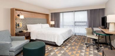 King bedroom with workstation at Holiday Inn Toronto Airport East.