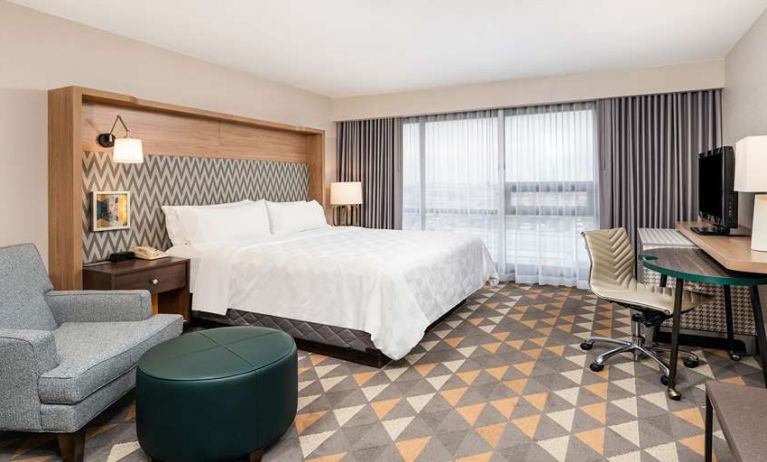 King bedroom with workstation at Holiday Inn Toronto Airport East.