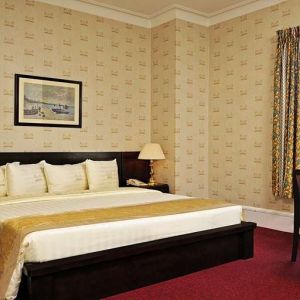 King bedroom with desk at Congress Plaza Hotel.