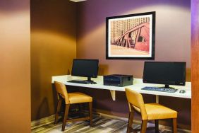 Business center with computers and printer at La Quinta Inn & Suites By Wyndham Chicago Downtown.