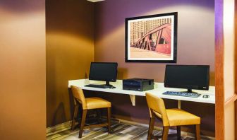 Business center with computers and printer at La Quinta Inn & Suites By Wyndham Chicago Downtown.