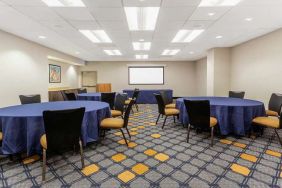 Meeting room with round tables at La Quinta Inn & Suites By Wyndham Chicago Downtown.