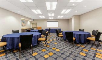 Meeting room with round tables at La Quinta Inn & Suites By Wyndham Chicago Downtown.