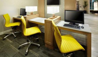 Business center with computers at Hyatt Place Miami Airport East.