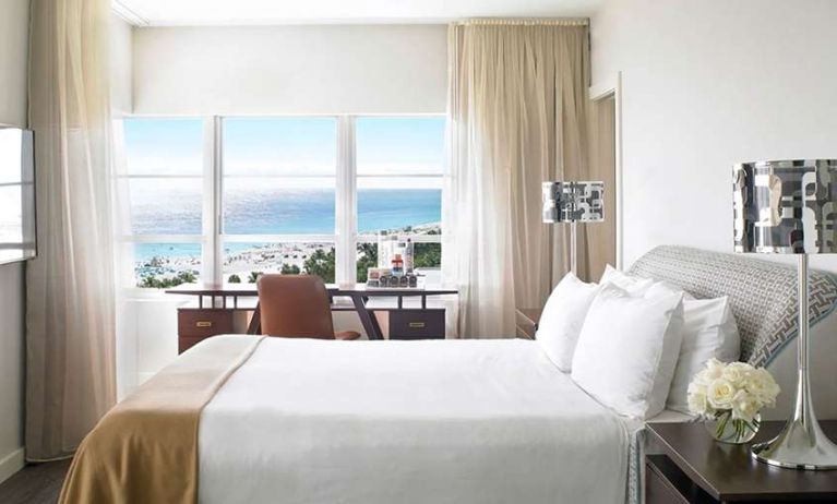 King bedroom with working station overlooking the water at Shelborne South Beach.