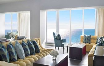 Beautiful living room with sea view perfect as workspace at Shelborne South Beach.