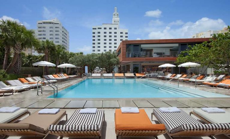 Outdoor pool with lounges at SLS South Beach.