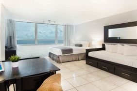 Queen room with workstation at New Point Miami.