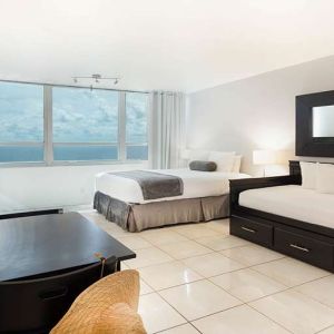 Queen room with workstation at New Point Miami.