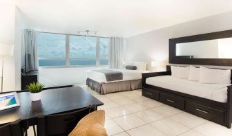 Queen room with workstation at New Point Miami.