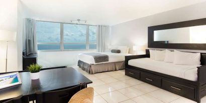 Queen room with workstation at New Point Miami.