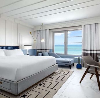 King bedroom with workstation at Cadillac Hotel & Beach Club, Autograph Collection.