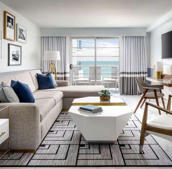 Living room with l shape sofa at Cadillac Hotel & Beach Club, Autograph Collection.