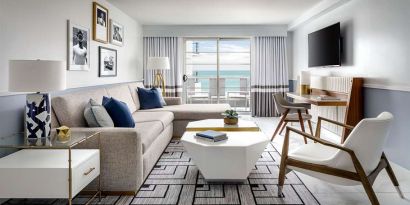 Living room with l shape sofa at Cadillac Hotel & Beach Club, Autograph Collection.