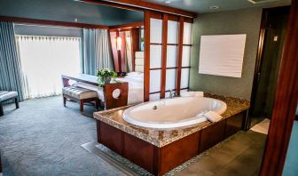 King bedroom with bathtub at Shade Hotel Manhattan Beach.