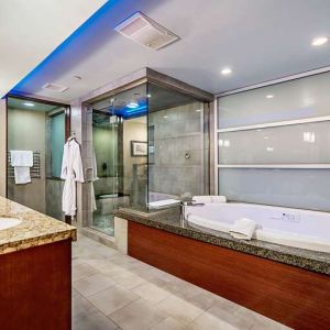 Guest bathroom with bathtub at Shade Hotel Manhattan Beach.