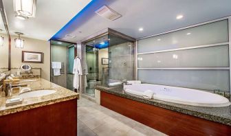 Guest bathroom with bathtub at Shade Hotel Manhattan Beach.