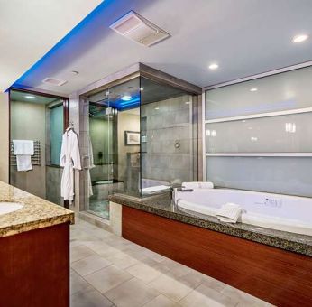 Guest bathroom with bathtub at Shade Hotel Manhattan Beach.