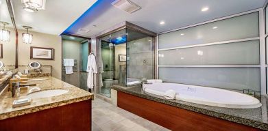 Guest bathroom with bathtub at Shade Hotel Manhattan Beach.