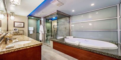 Guest bathroom with bathtub at Shade Hotel Manhattan Beach.