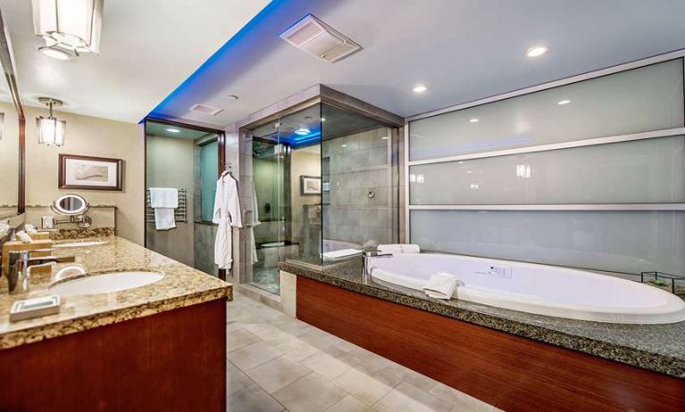 Guest bathroom with bathtub at Shade Hotel Manhattan Beach.