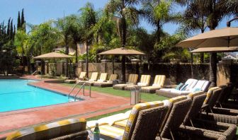 Pool area with lounges at Hollywood Hotel.